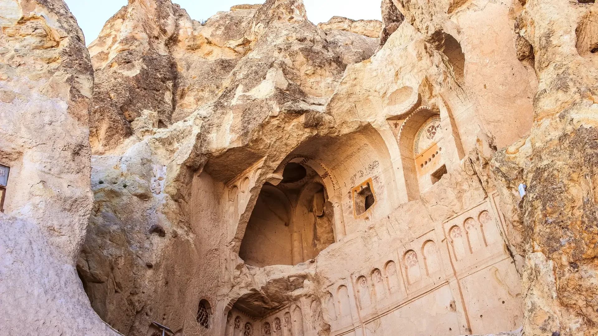 Carved chambers in a rock face