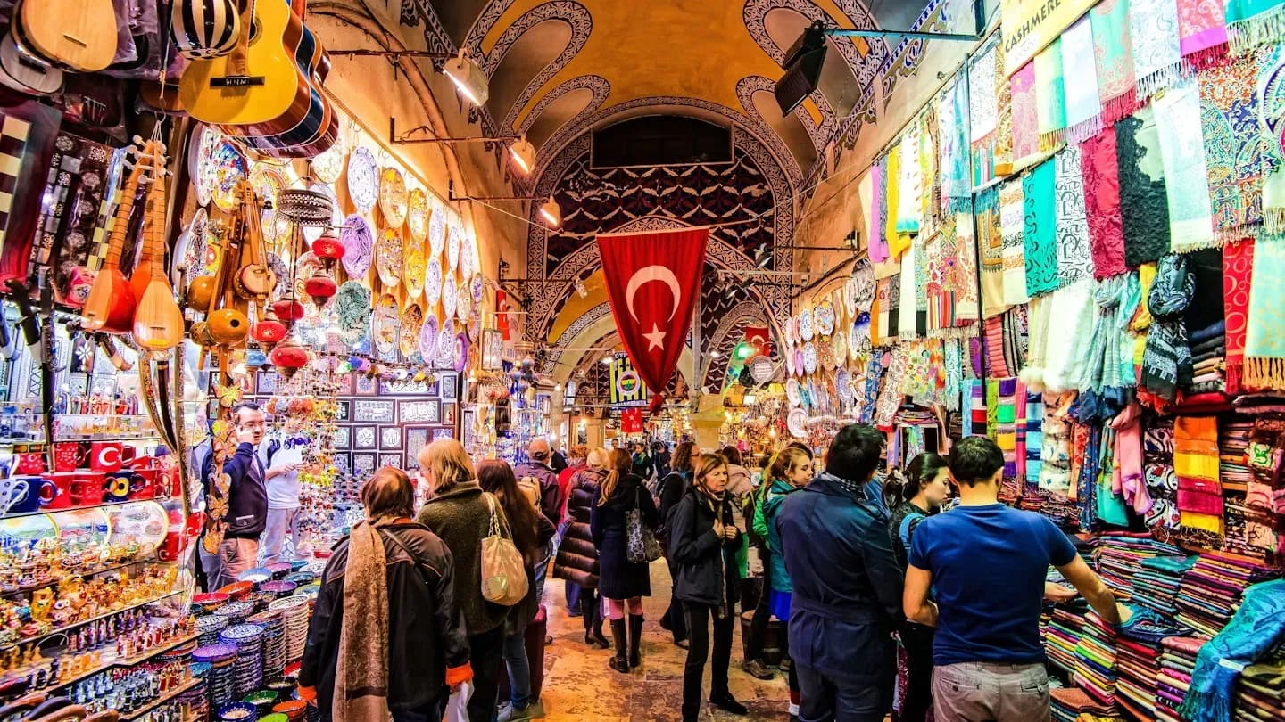 Colourful market stalls beneath a vaulted ceiling
