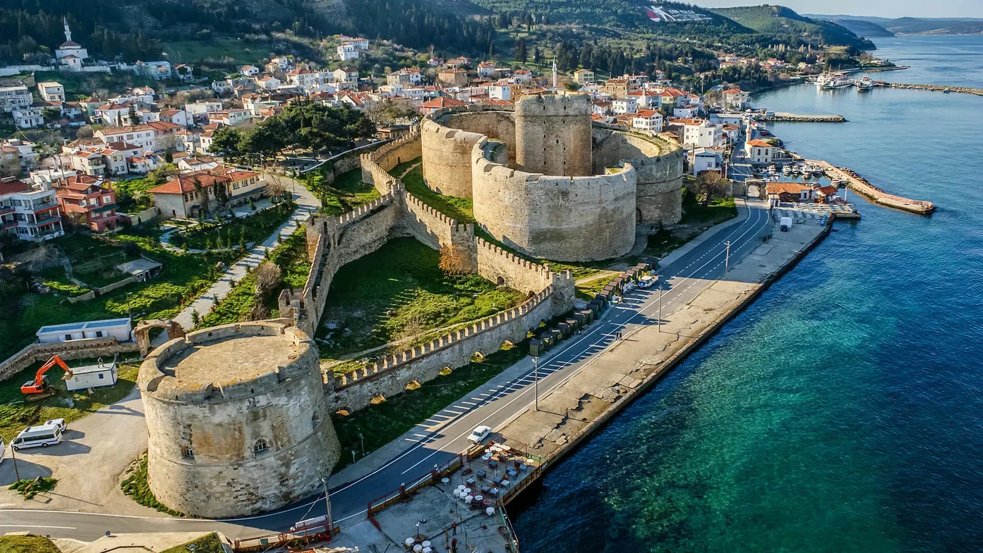 Stone fortress beside a coastal town