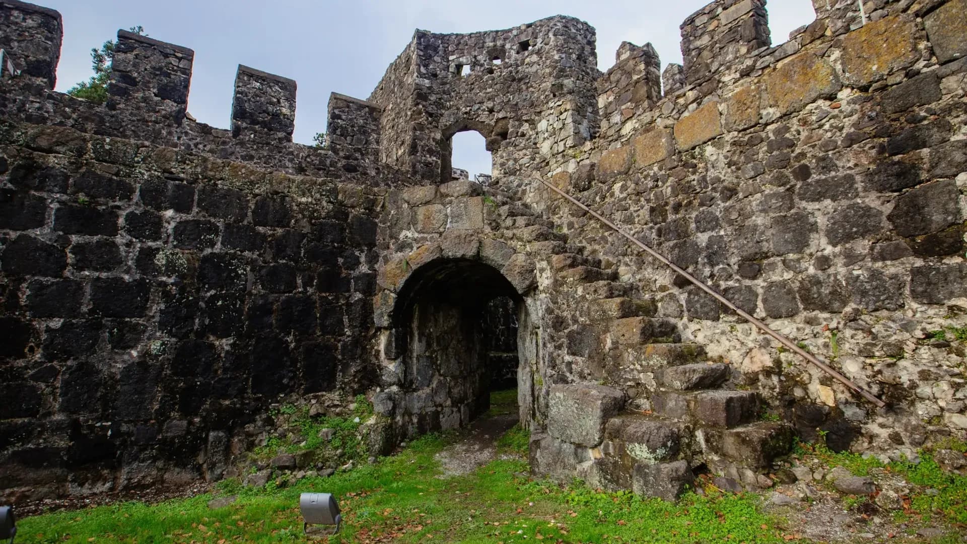 Arched entrance in a stone fortress wall