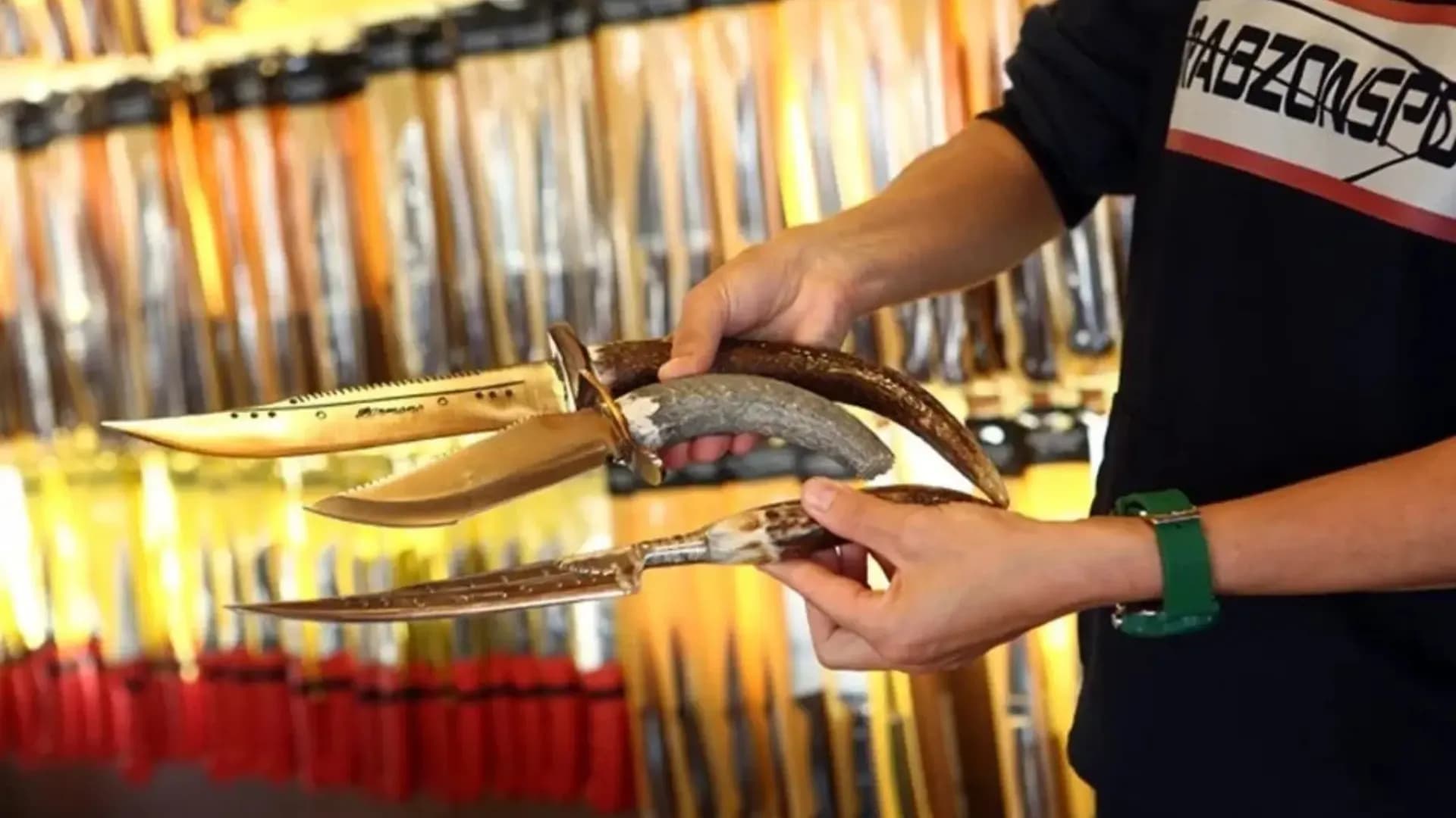 Hands playing a small bowed string instrument