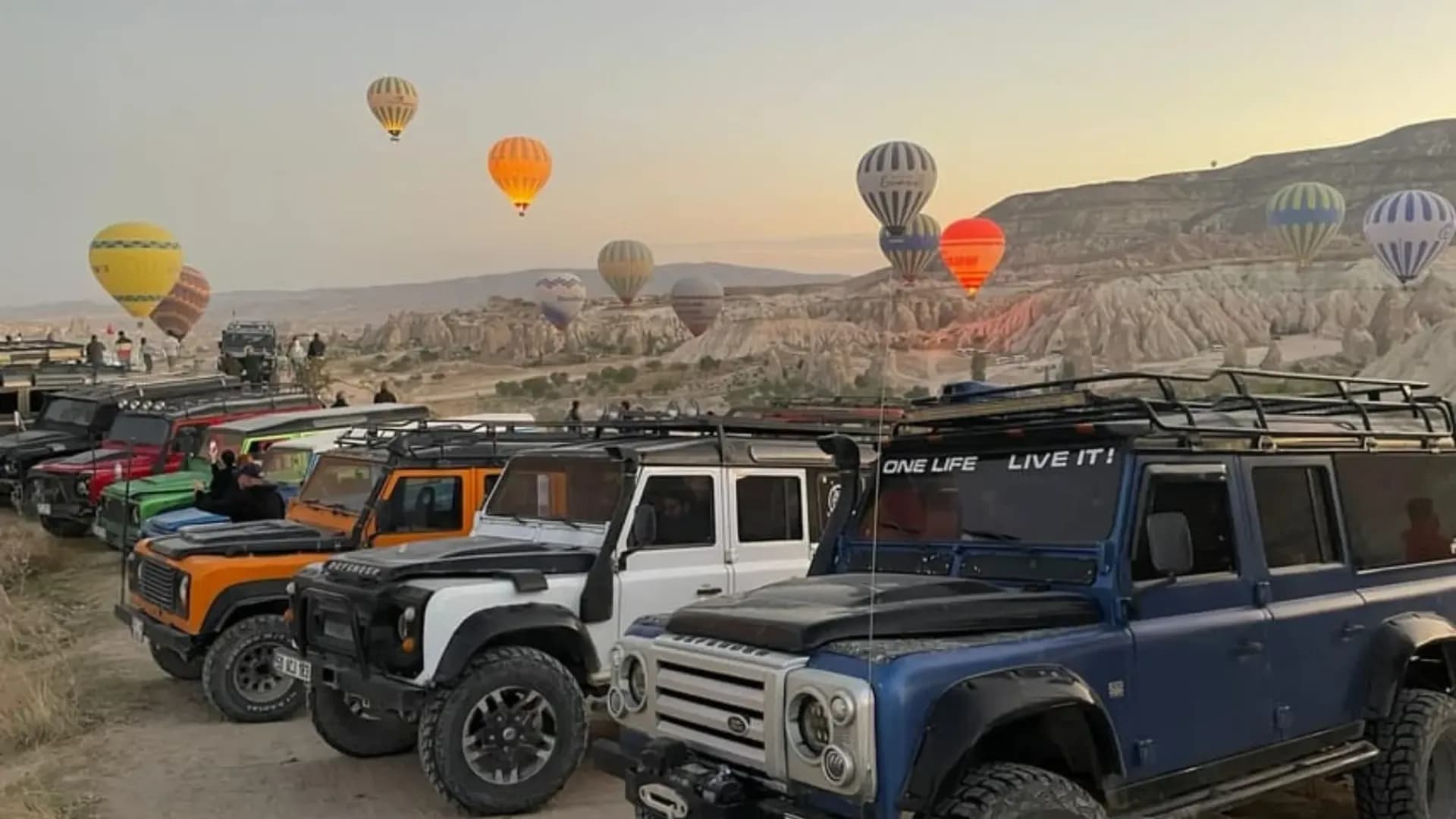 Parked off-road vehicles and balloons