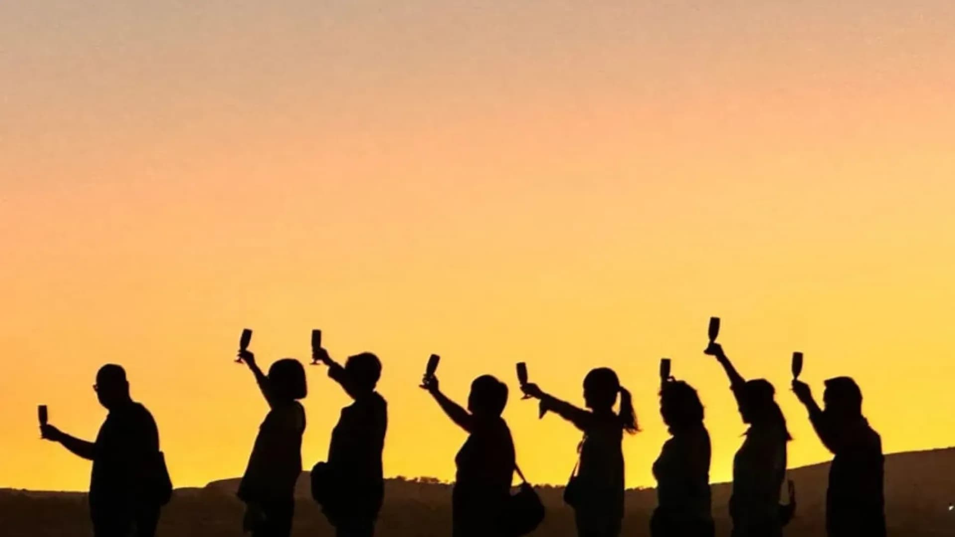 People silhouetted against the sunset