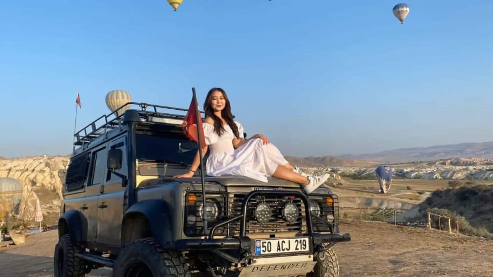 Person sitting on an off-road vehicle