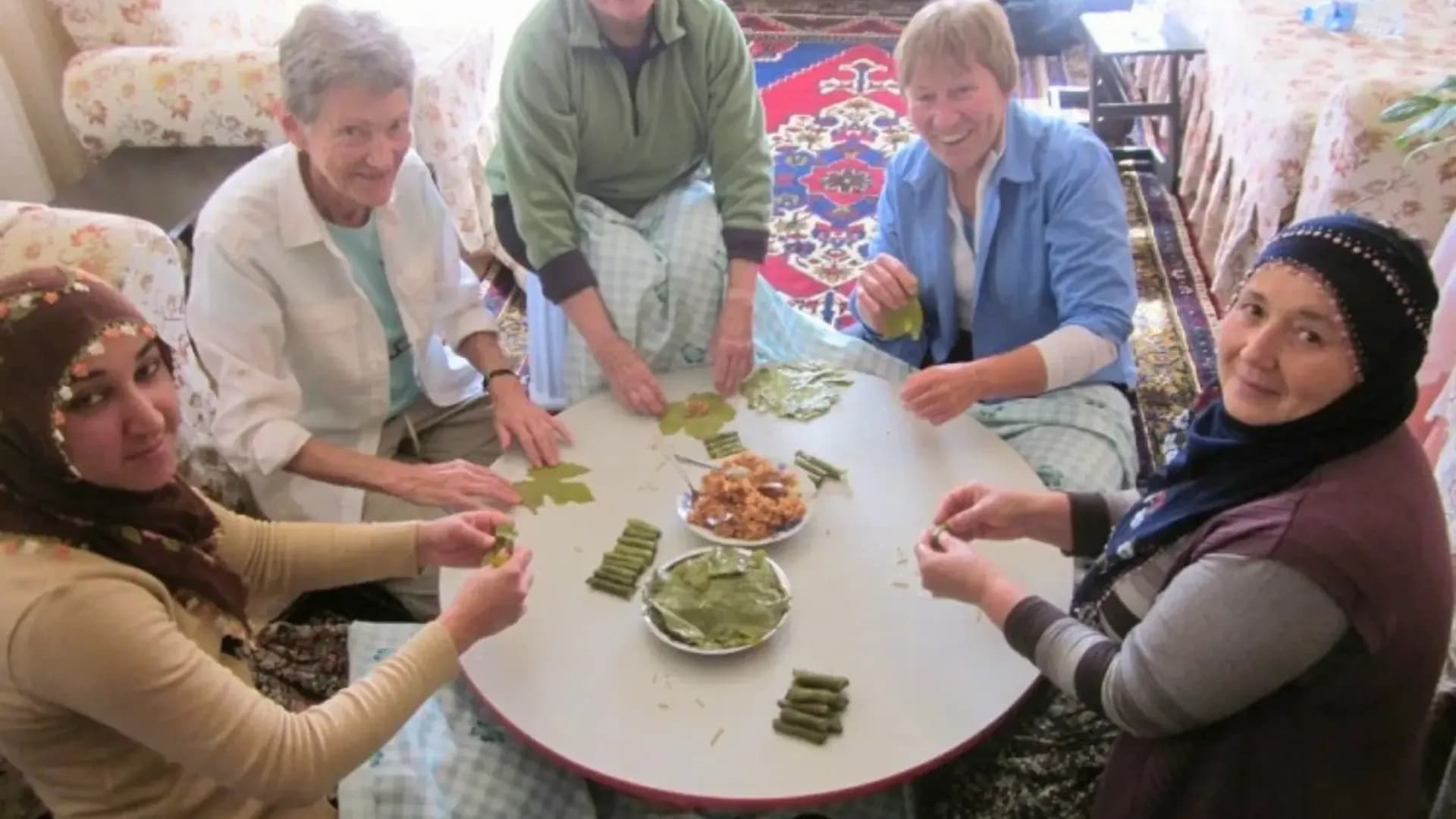 People preparing food around a table