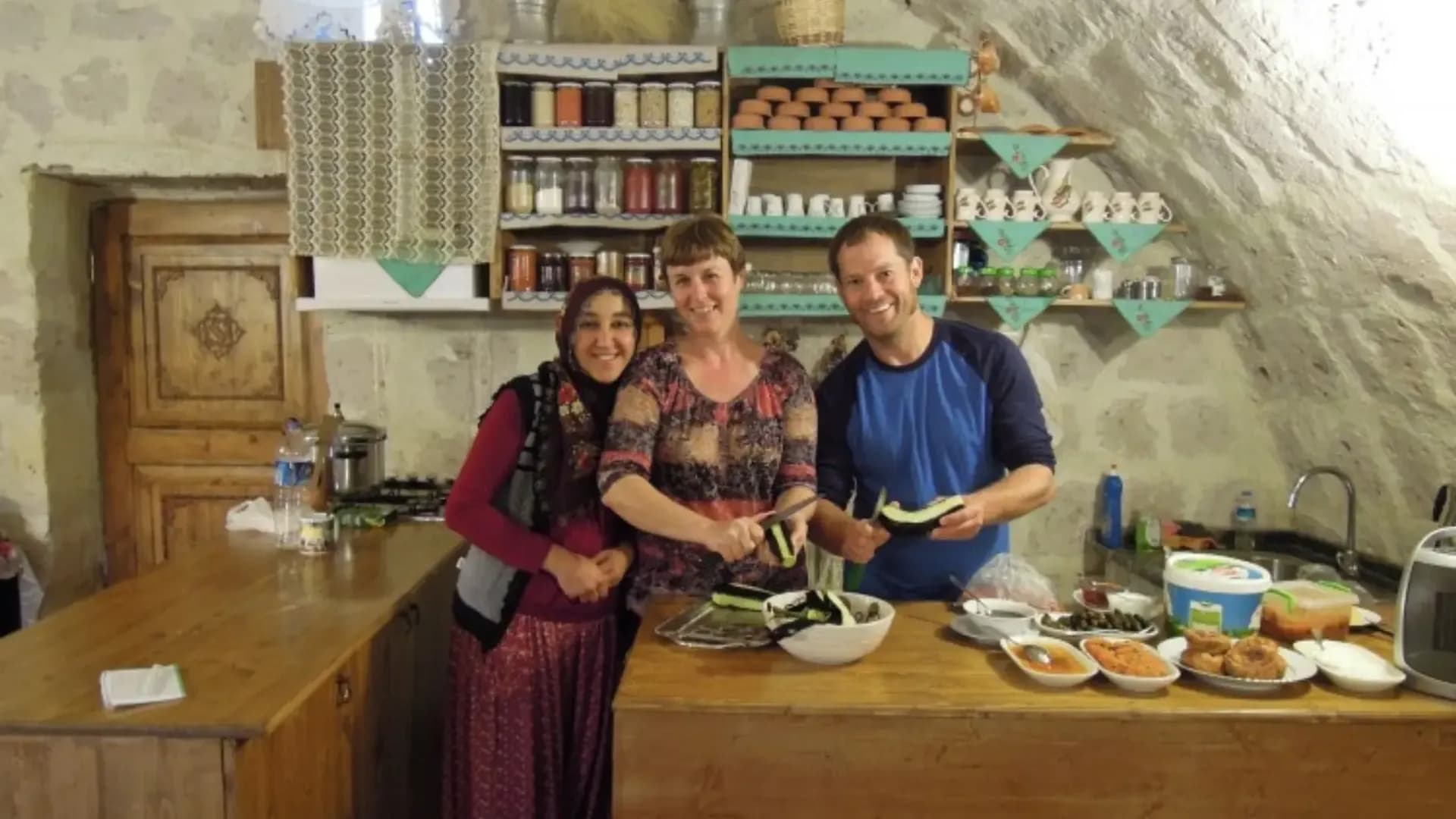 People standing behind prepared dishes