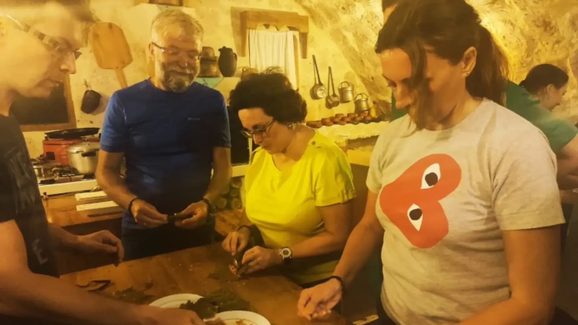 People chopping ingredients in a kitchen