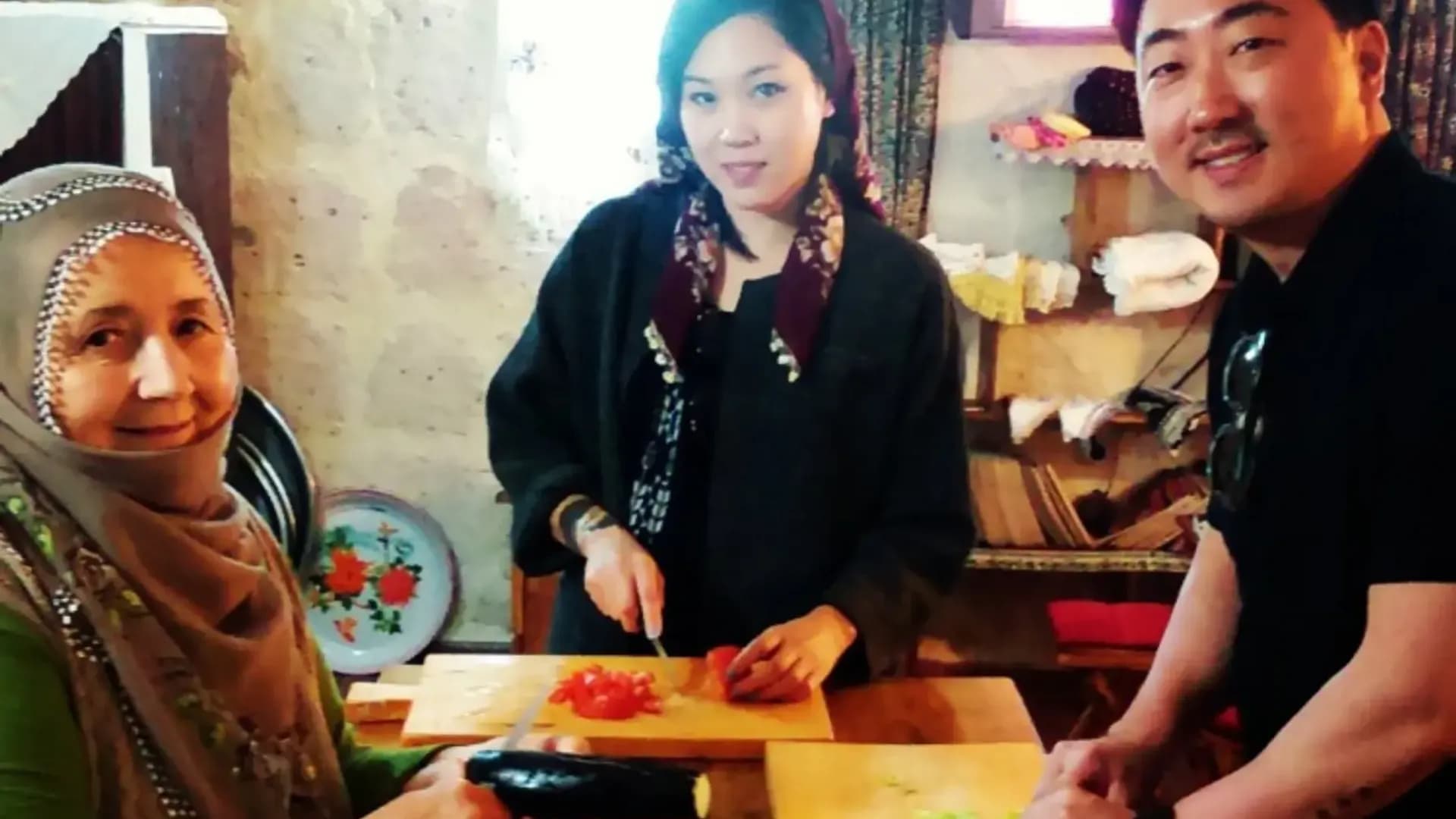 People preparing vegetables at a table