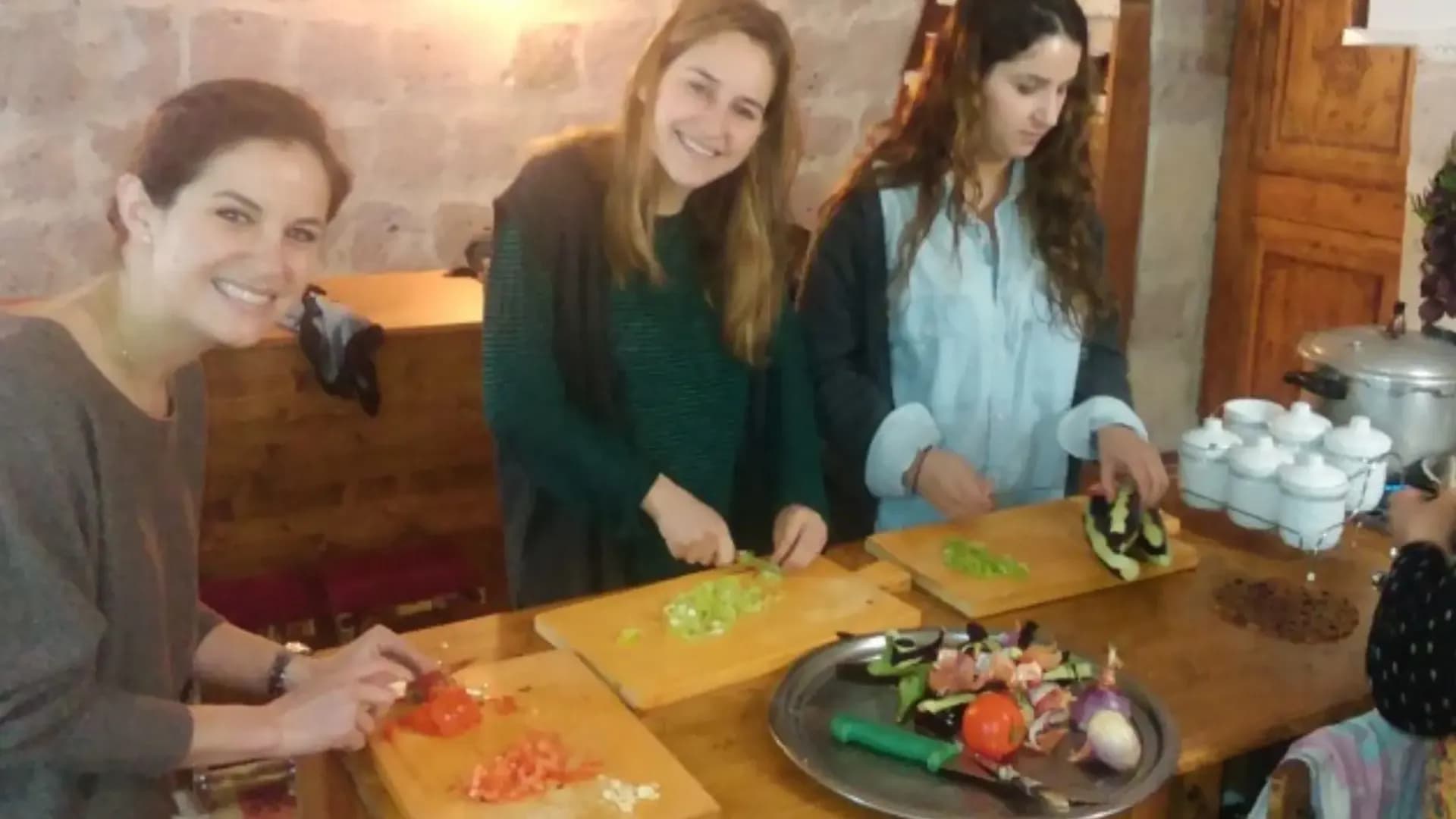 People chopping vegetables together