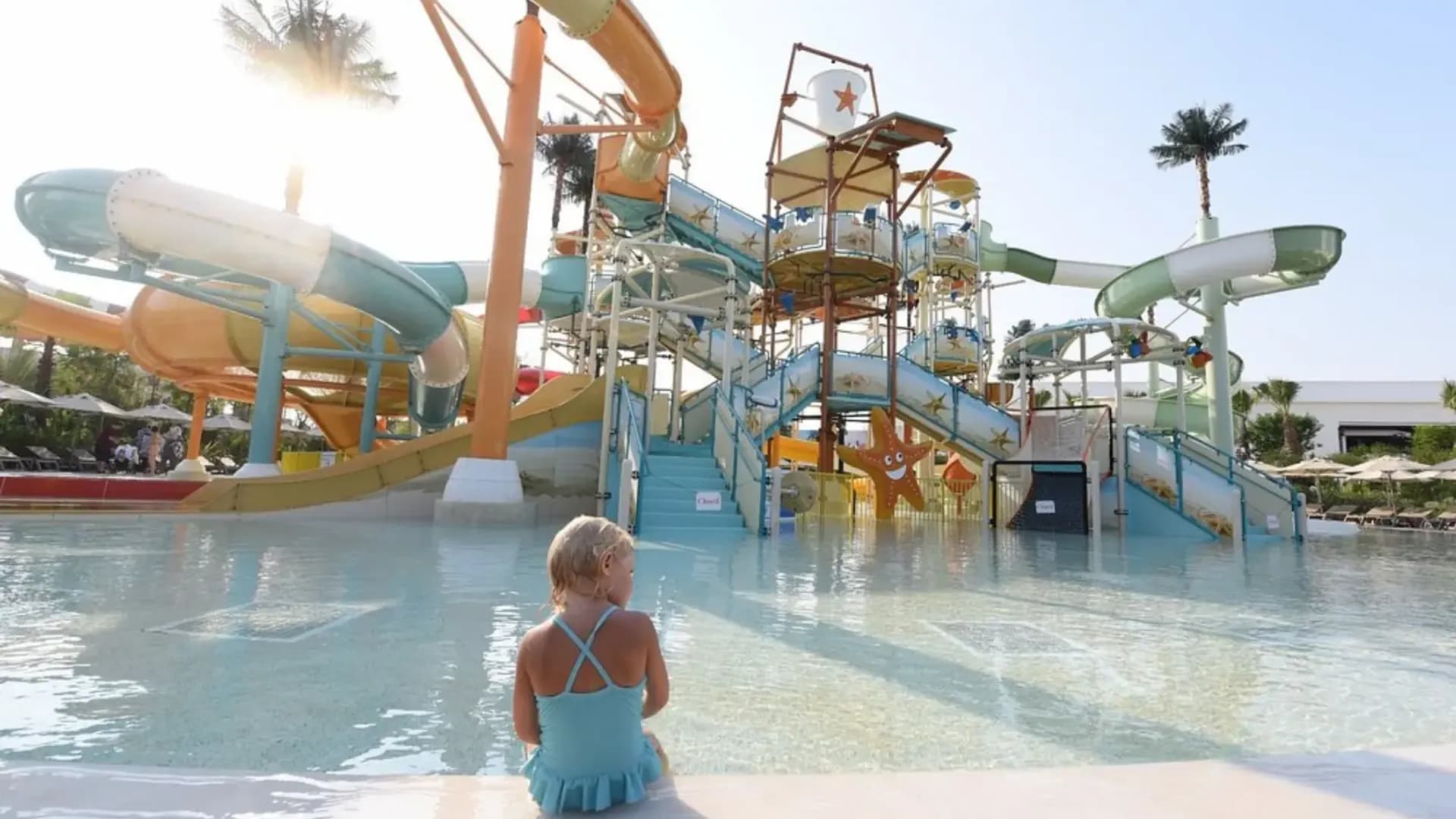 Water slide beside a pool