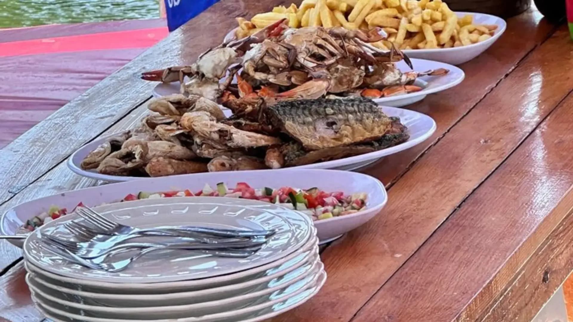 Cooked fish and side dishes on a table