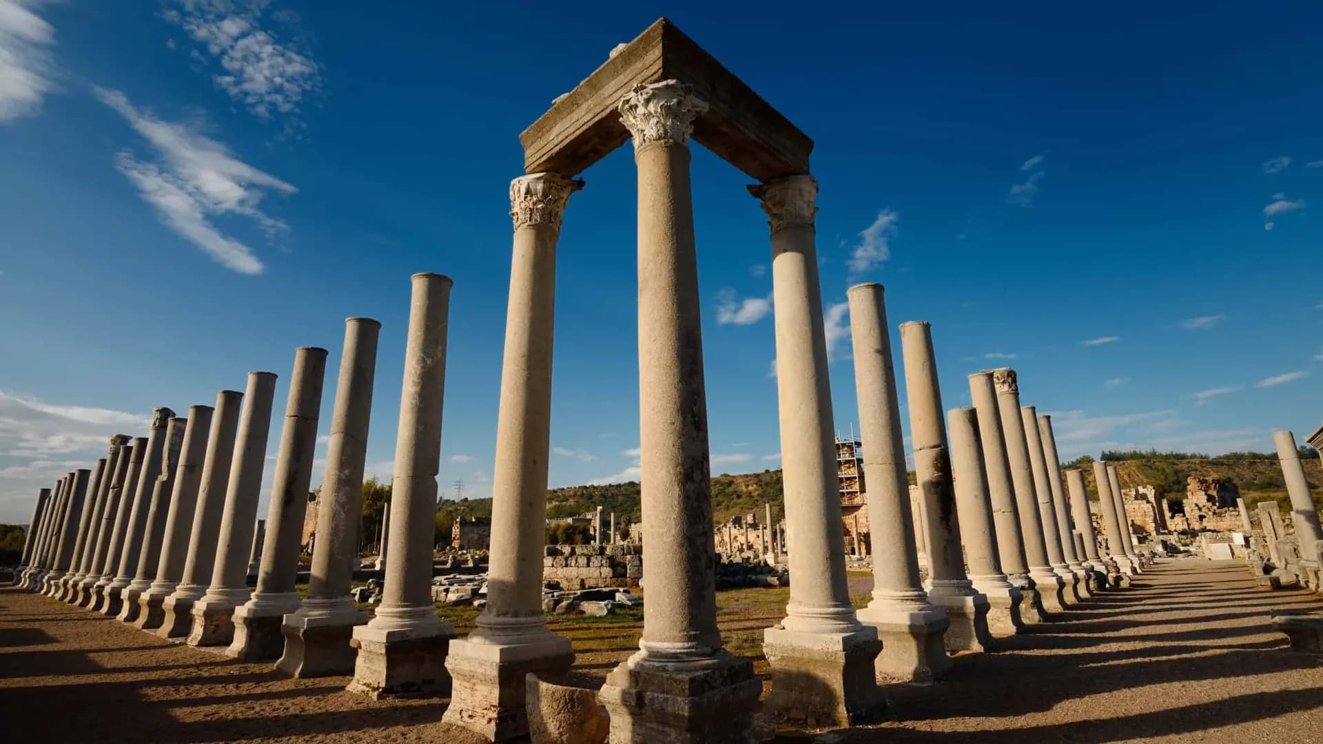 Rows of ancient columns above stone paving