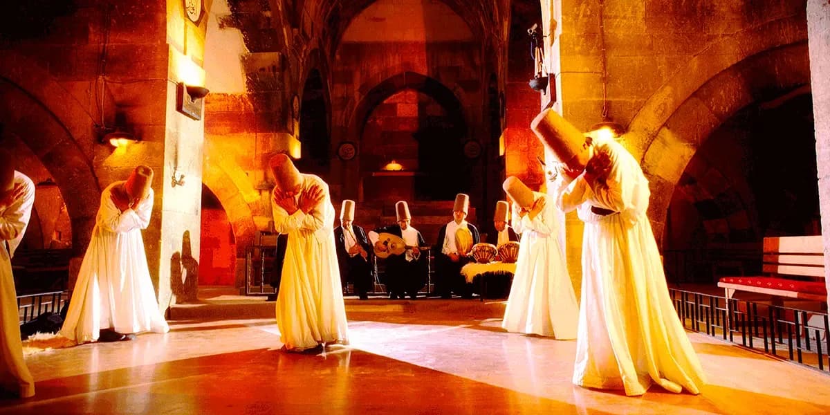 Whirling performers inside a historic hall