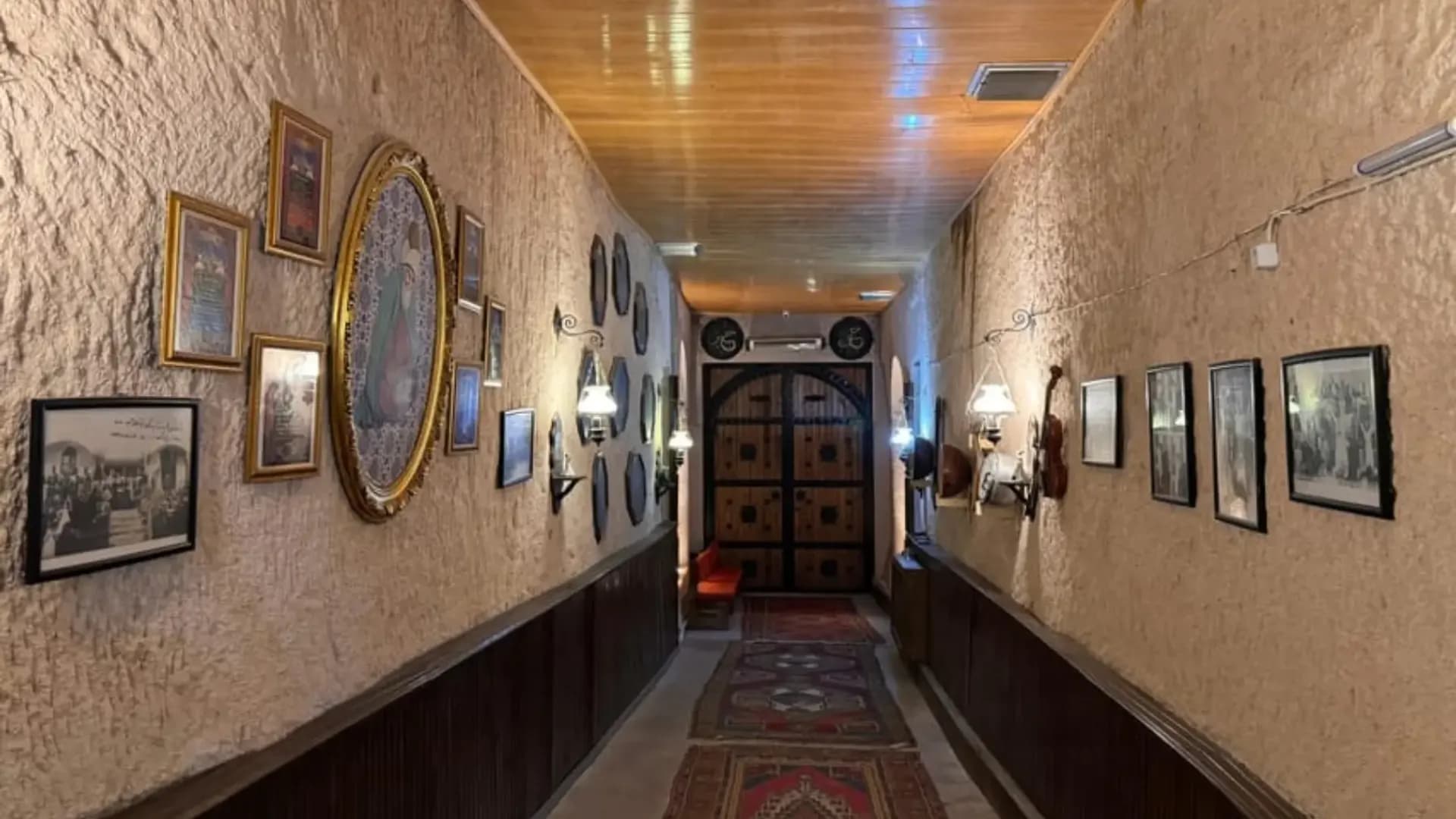 Corridor lined with framed displays