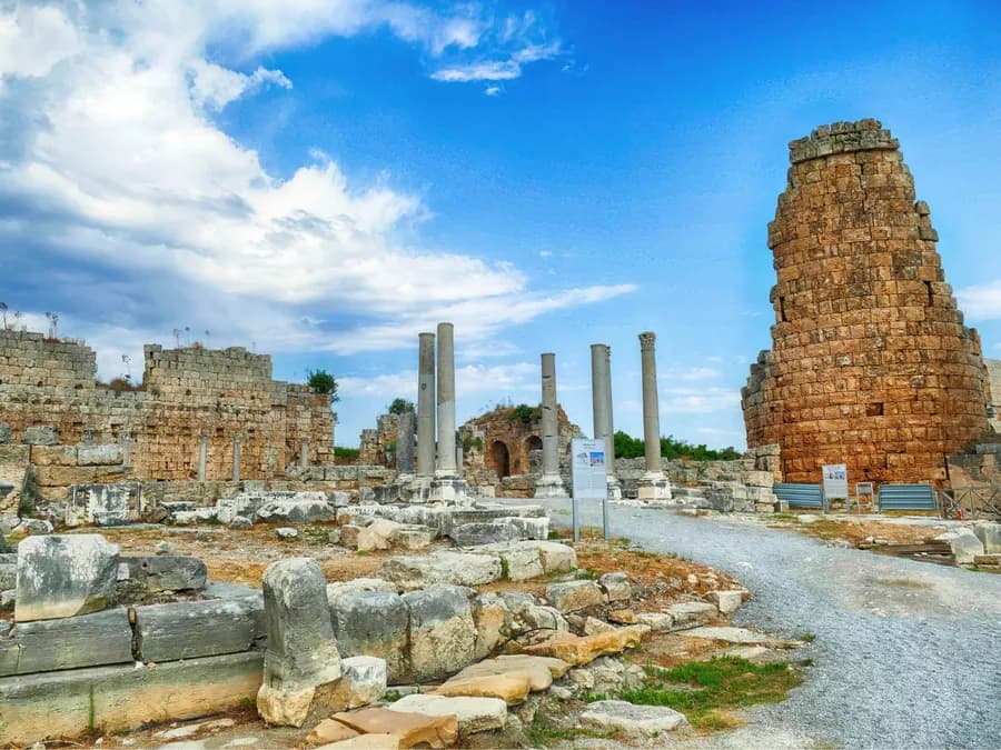 Stone ruins and columns beneath a blue sky